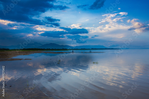 Clear sunrise on a water mirror cloudy