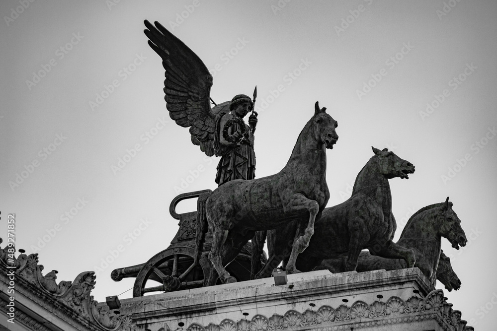 Fototapeta premium Sculptures and buildings in Rome, Italy