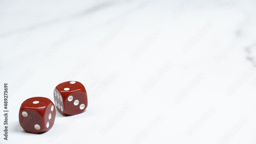 Red dices on a light background with copy space Red dices on a light background with copy space