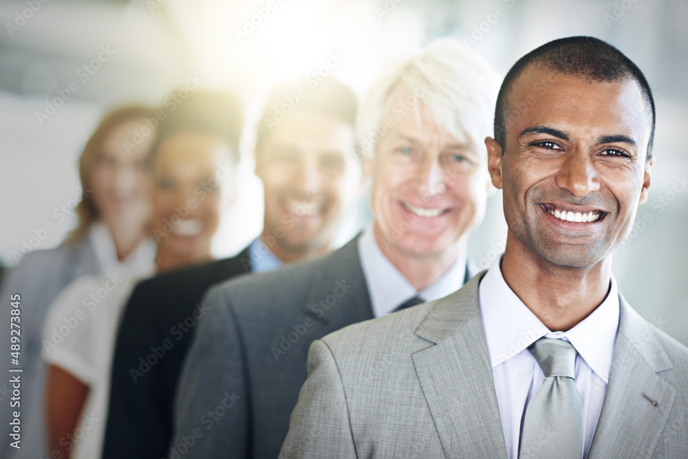 Were the best team in the business. Cropped portrait of a group of diverse businesspeople standing in a line. Were the best team in the business. Cropped portrait of a group of diverse businesspeople standing in a line.