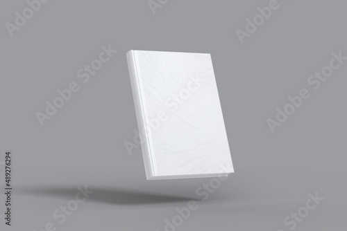 Blank floating white book on gray background mockup photo