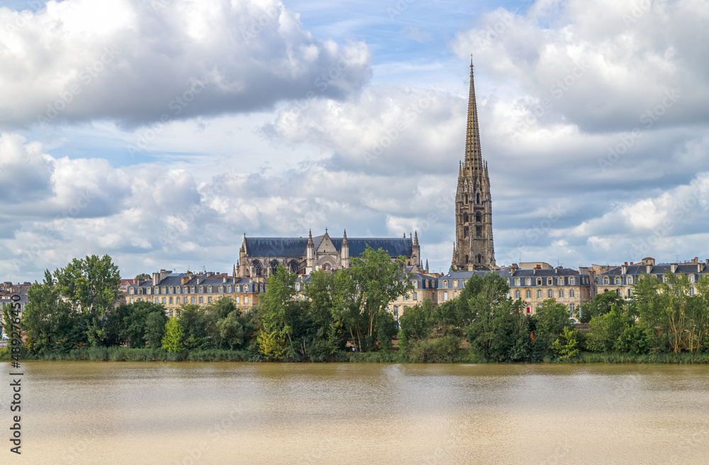 Bordeaux, France. Panoramic view of  city skyline with Saint Michel cathedral from the river Garonne.