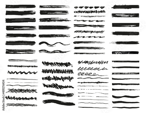 Grunge brushes. A set of isolated elements. Black rough samples. Rough smears and stains. Black paint strokes, ink paintbrush texture. Vector illustration