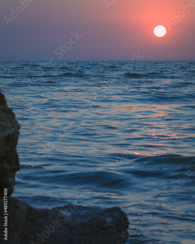 A beautiful sunset in seaview karachi pakistan. photo