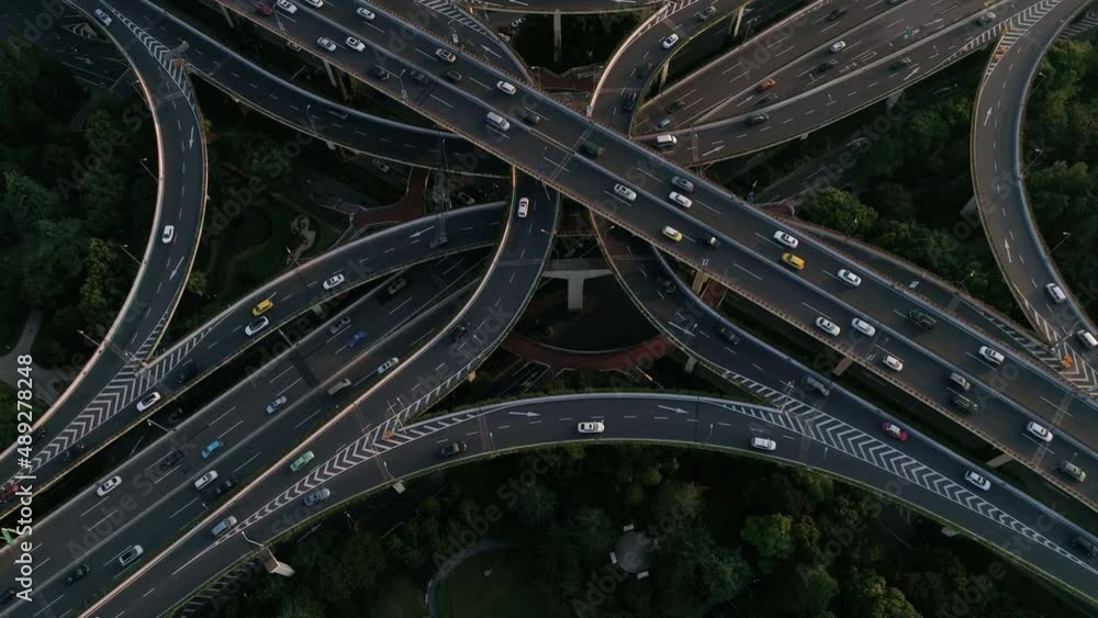 Aerial view of a busy road intersection with traffic in Shanghai downtown at night, China. Aerial view of a busy road intersection with traffic in Shanghai downtown at night, China.