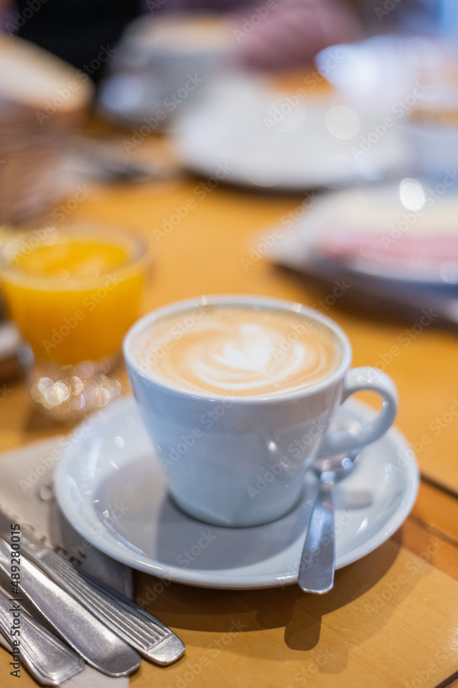 cup of coffee and spoon and juice orange cup of coffee and spoon and juice orange