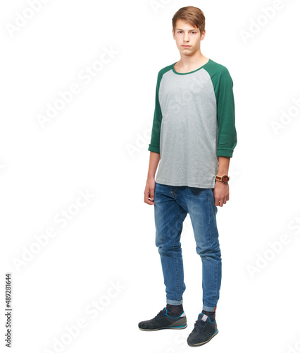 The road to fame and fortune starts here. A young teenage boy standing in a studio isolated on white.
