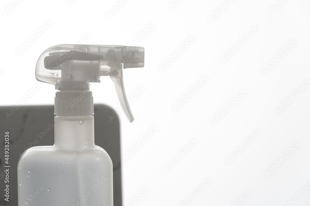 Close up white plastic foggy spray bottle head. Background for plastic in daily use. Close up white plastic foggy spray bottle head. Background for plastic in daily use.