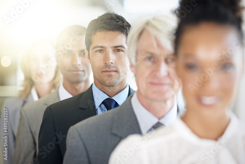 Corporate confidence. Cropped shot of a group of diverse businesspeople standing in a line.