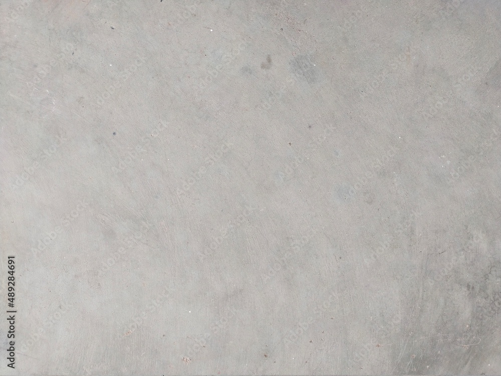 Naklejka premium The cement concrete floor has a uniquely beautiful pattern that can be used as a beautifully designed background.