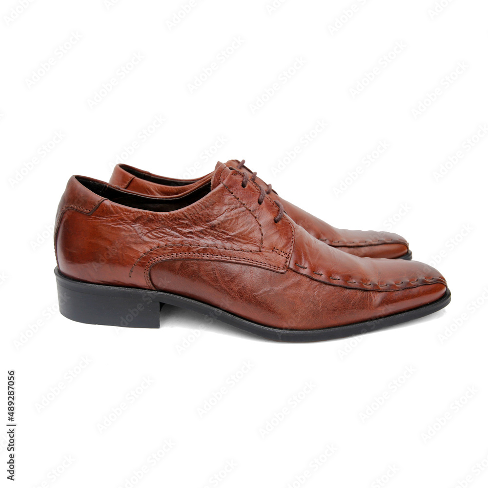 Male brown leather shoes on white background, isolated product. Male brown leather shoes on white background, isolated product.