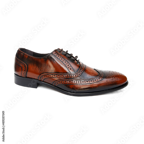 Male brown leather shoes on white background, isolated product. © GeorgeVieiraSilva