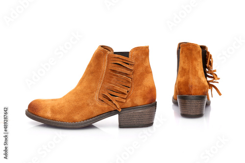 Female brown leather boots on white background  isolated product.