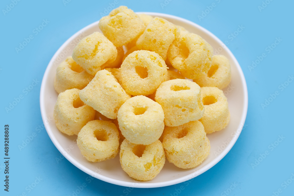 Roller corn snack on blue background. Roller corn snack on blue background.