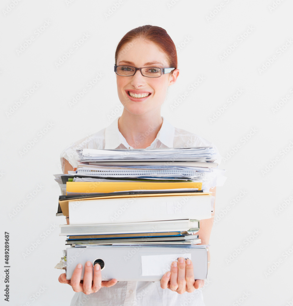 Time to hit the books. A student carrying a pile of files and books. Time to hit the books. A student carrying a pile of files and books.