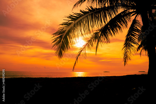 Tropical beach sunset with orange sky