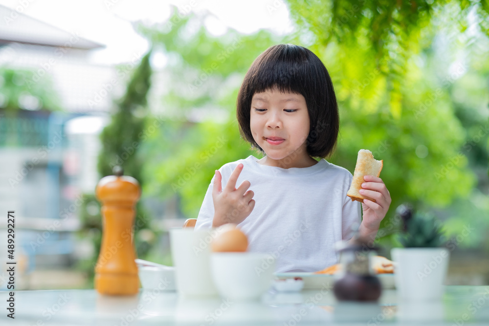 Little girl have breakfast, happy time Little girl have breakfast, happy time