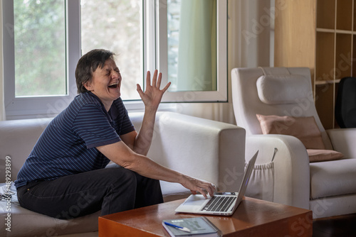 adult woman working at home with computer © patoouupato