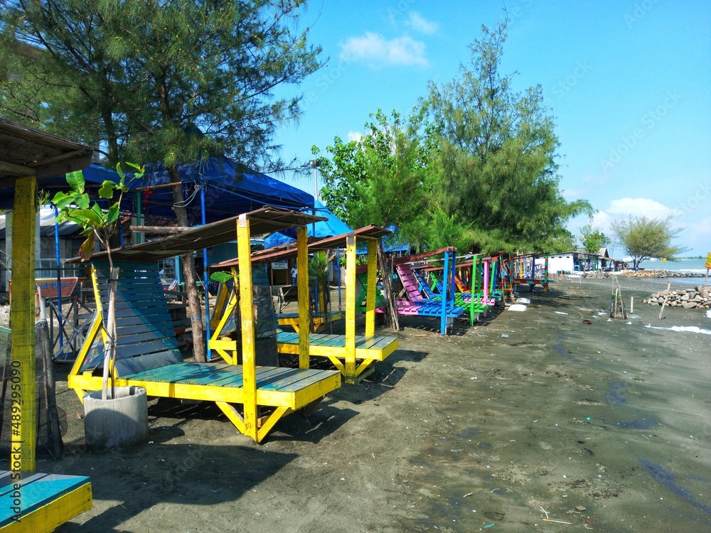 lounge chairs for sunbathing on the beach with colorful, beach view, beach trees lounge chairs for sunbathing on the beach with colorful, beach view, beach trees