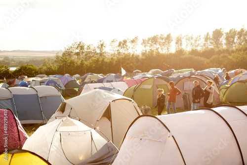 Camping is the way to go. Shot of a large group of tents on a campsite at a festival. photo