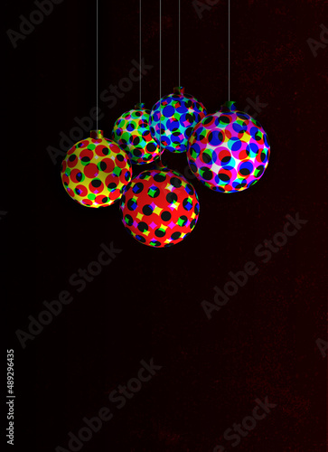 hanging balls with colorful halftone patterns on a dark background