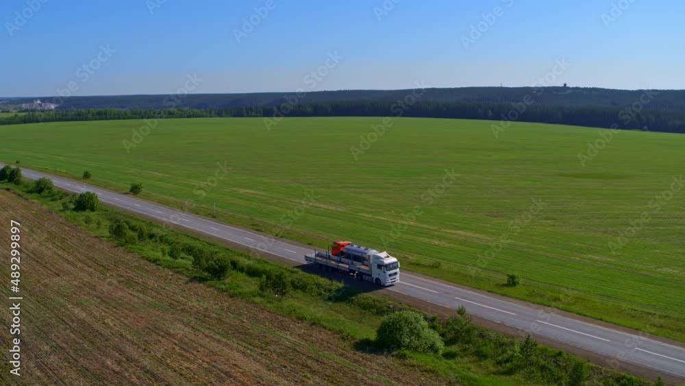Aerial view of a truck on the highway in nature Aerial view of a truck on the highway in nature