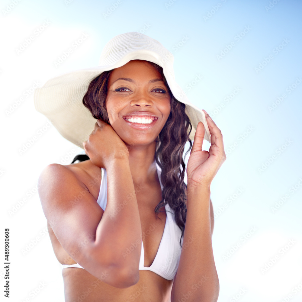 Basking in the summer glow. A beautiful young african woman enjoying the summer sun. Basking in the summer glow. A beautiful young african woman enjoying the summer sun.