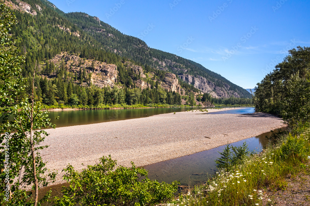 Mountains and river landscape. Location place is Flathead River in the Glacier National Park, Montana