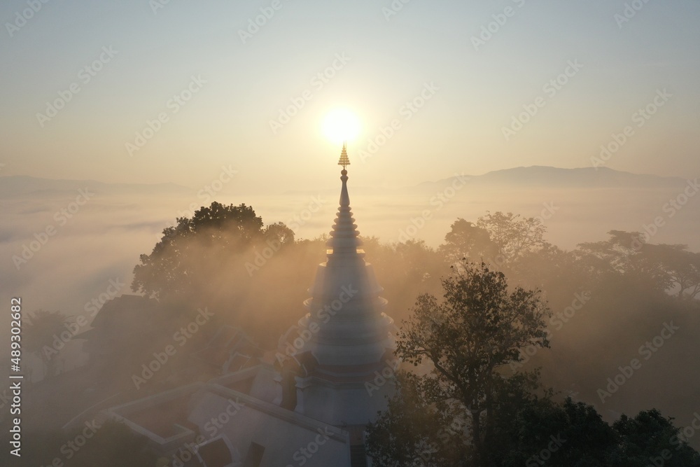 Background image, sunrise, sea of ​​fog, Phra That Pha Ngao Temple, Chiang Saen District, Chiang Rai Province, Asia
