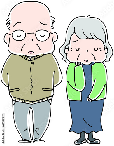 並んで立つおじいさんとおばあさん