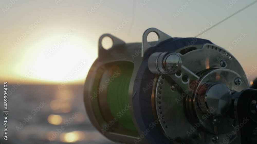 Afternoon Sun on fishing reel in Slow Motion Afternoon Sun on fishing reel in Slow Motion