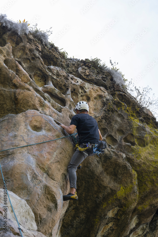 Rock Climber climbing the route La Presuda in Suesca Colombia