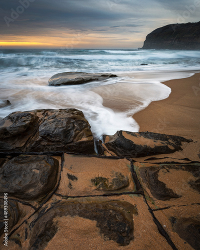 rocks and waves with sand on the beach at mcmasters photo