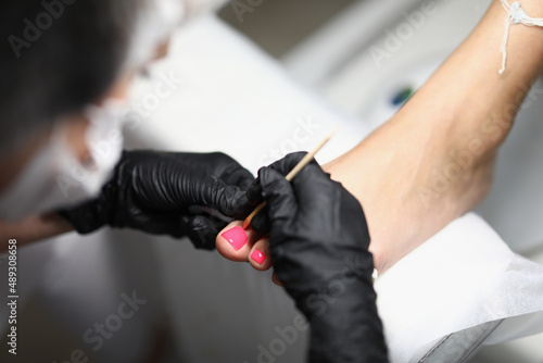 Black protective gloves on hands