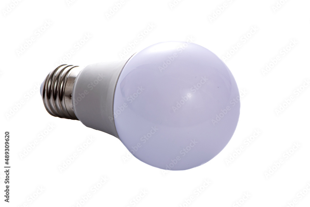 A white LED lamp with an E27 base lies on a white insulated background A white LED lamp with an E27 base lies on a white insulated background