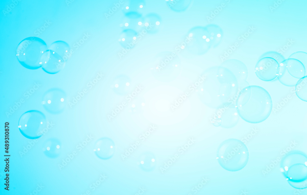 Beautiful Transparent Blue Soap Bubbles Texture on a White Background.	
