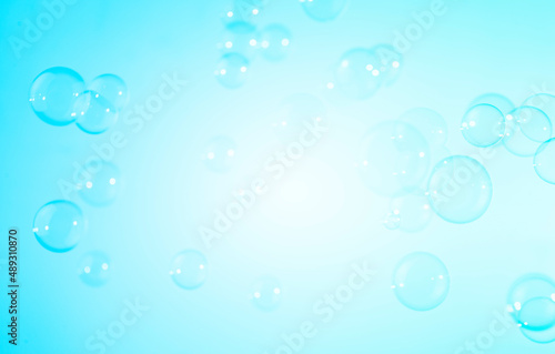 Beautiful Transparent Blue Soap Bubbles Texture on a White Background. 