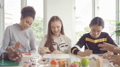 A group of multi ethnic of students kids and teachers study  learn art painting  drawing in school. Education in classroom. People lifestyle