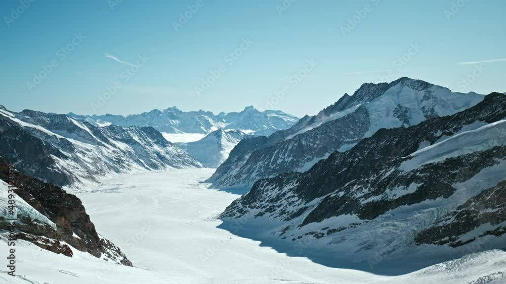 Panoramic view of the Swiss Alps on Top of Europe in Jungfrau, Lauterbrunnen. Scenic view from above of the Alps on a winter sunny day from Jungfraujoch observation deck in 4K Prores. Panoramic view of the Swiss Alps on Top of Europe in Jungfrau, Lauterbrunnen. Scenic view from above of the Alps on a winter sunny day from Jungfraujoch observation deck in 4K Prores.