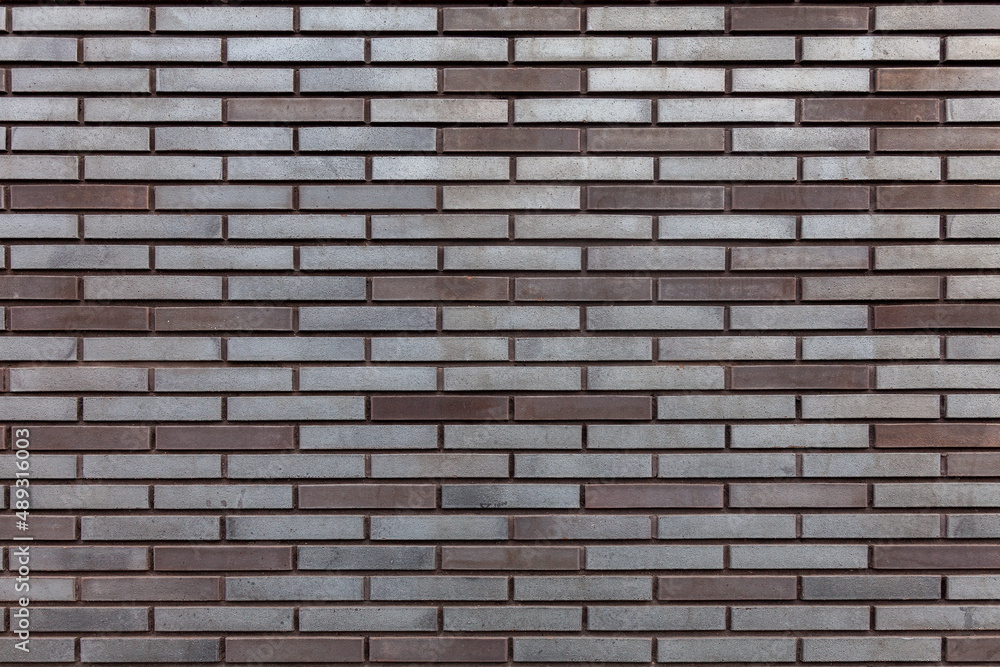Background image - Textured brick wall in gray-brown tones Background image - Textured brick wall in gray-brown tones