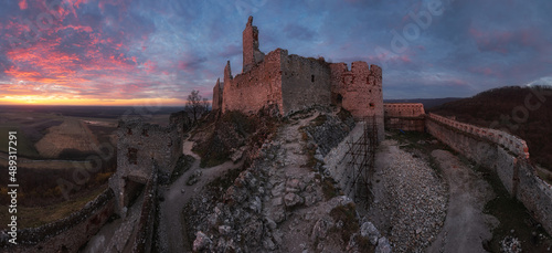 Ruin of castle Plavecky in Slovakia - Panorama of dramatic sunset photo