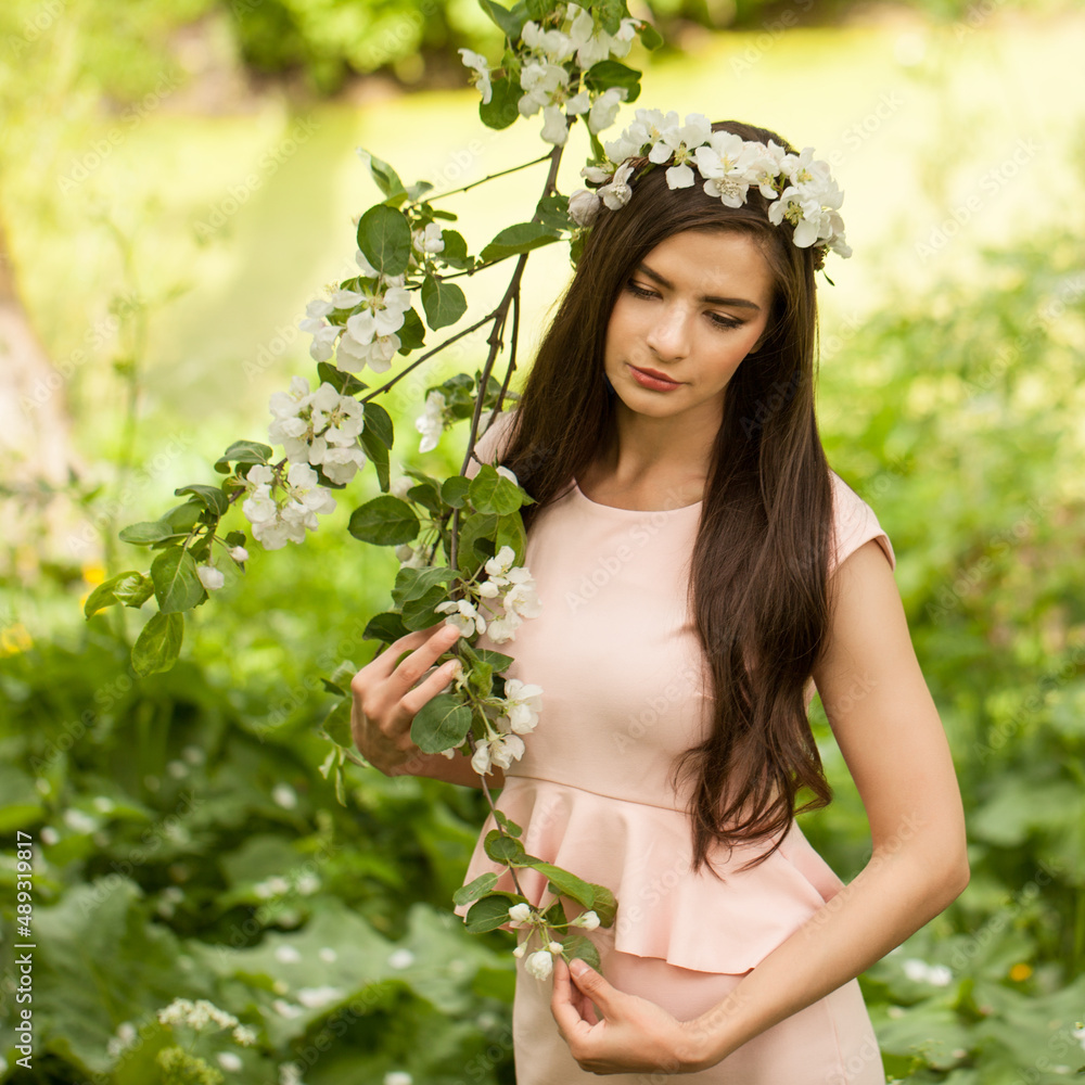 Beautiful model walking in spring garden. Beautiful model walking in spring garden.
