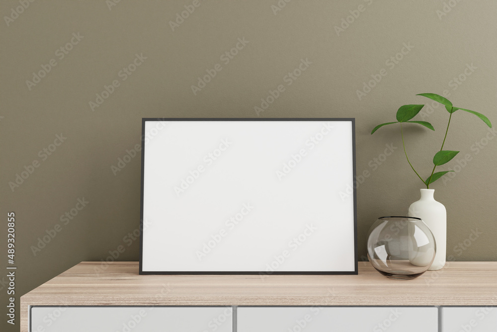 Minimalist and clean horizontal black poster or photo frame mockup on the wooden table in living room with vase and plant