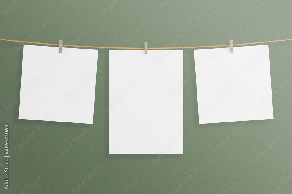 Triple minimalist hanging canvas poster or photo frame mockup in living room wall Triple minimalist hanging canvas poster or photo frame mockup in living room wall