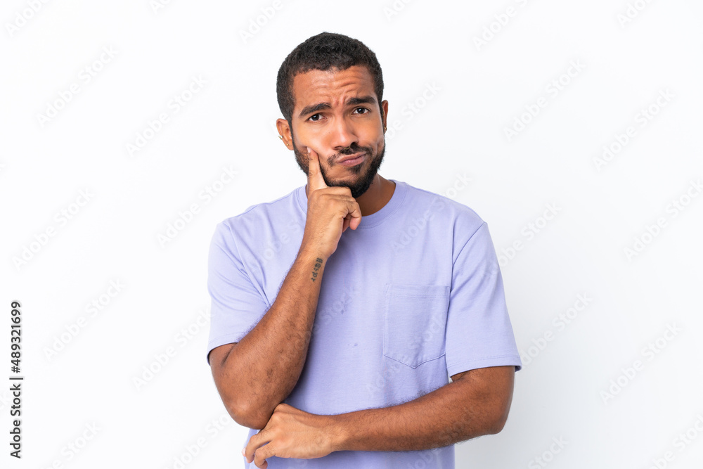 Young Ecuadorian man isolated on white background and thinking Young Ecuadorian man isolated on white background and thinking