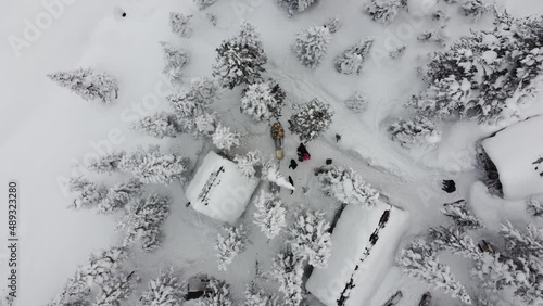 Carefree children ride on sleds and on tubes winter in the most beautiful placesn Russia, Siberia Near Lake Baikal in a mountain gorge called Mamai. Beautiful views taken from a quadcopter
 photo