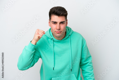 Young caucasian man isolated on white background with unhappy expression © luismolinero