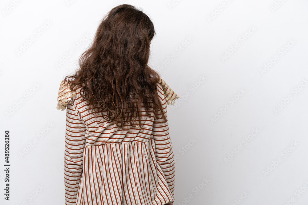 Little girl isolated on white background in back position and looking side Little girl isolated on white background in back position and looking side