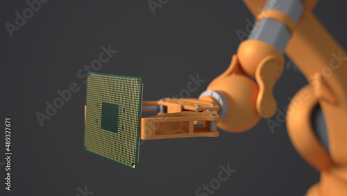 The orange robot holds a productive processor for a personal computer. Blurry gray background. The concept of future technologies . semiconductors.