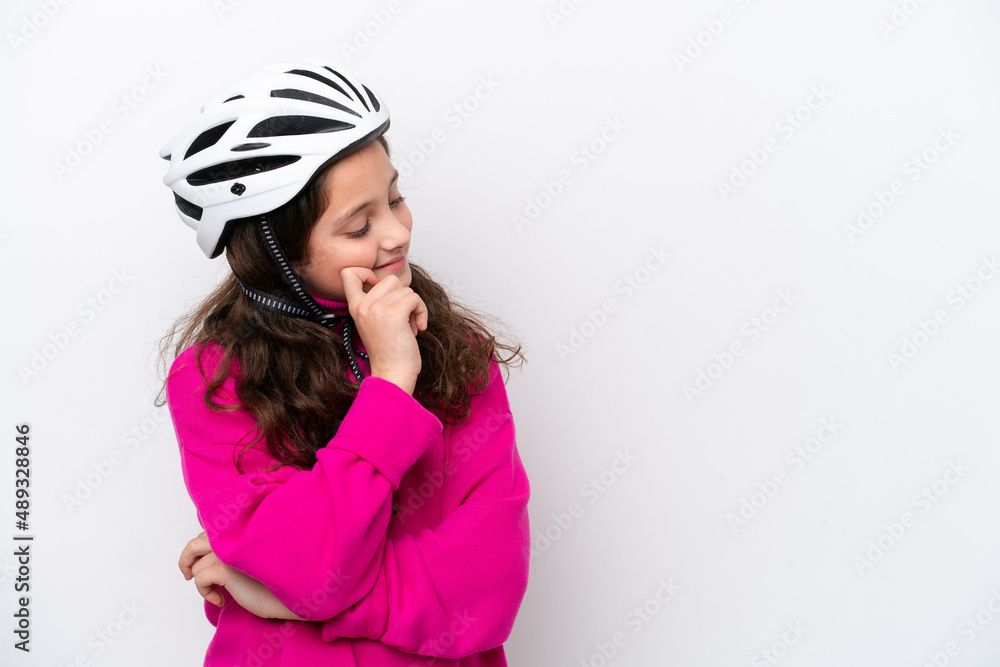 Little cyclist girl isolated on white background looking side Little cyclist girl isolated on white background looking side